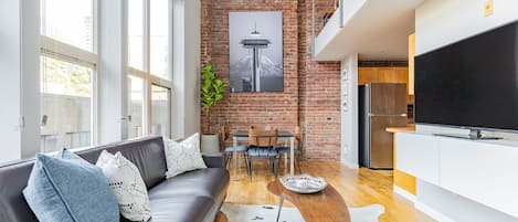 Original 1889 brick wall, one of a kind art and high quality finishes.