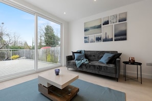 Lounge area with couch bed with garden view