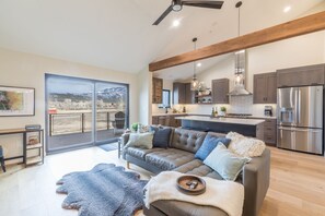 View from Dining Area - Open Layout with Views of the Living Room, Kitchen, and Large Sliding Doors to the Deck (2nd Floor)