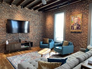 View of living room with 70-inch Smart TV