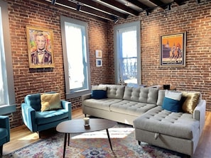 Living room seating that converts to a queen-sized, sofa bed