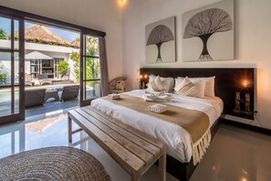 bedroom with a pool view