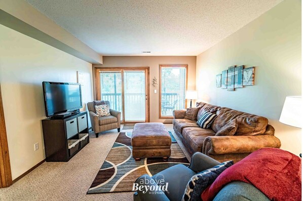 Relax in a spacious lounge with a TV and balcony access