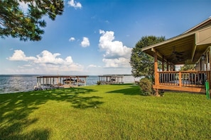 Relax or nap on the swing under the huge pine tree while gazing at the lake.