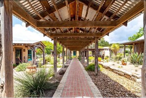 The focal point of Mucho Gusto is this brick-paved breezeway, strung with glittering outdoor lighting.