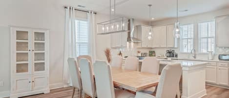 Luxurious kitchen with all cooking utensils, oil, spices, coffee, sugar, cream