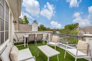Unobstructed skyline views, outdoor dining for 6, additional seating & lush turf