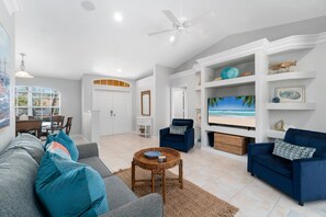 Inside the Secret Beach Retreat you'll find cozy furnishings in a palette of sea and sand with splashes of tropical color.