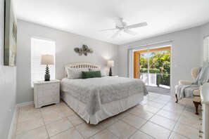 The primary bedroom is just steps from the pool.
