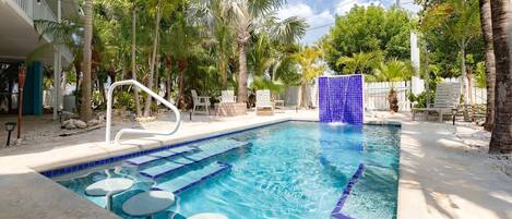 Grab a seat in the pool and stay cool as you bask in the water, offering a unique and refreshing way to relax at Tropical Serenity in Sugarloaf.