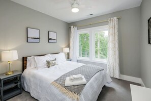 Bedroom Two has gorgeous views of the wooded lot and Lake Hartwell.