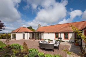 Westwood Cottage - terrace and patio area to the rear with outdoor dining furniture - perfect for al fresco dining