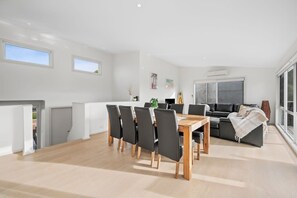Freshly renovated coastal retreat with open plan plan dining and living in the sunshine