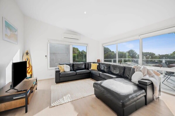 Gaze out and enjoy the views, or relax on the comfy lounge suite