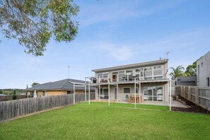 The fully fenced backyard ensuring a safe and enjoyable stay for your kids and pets