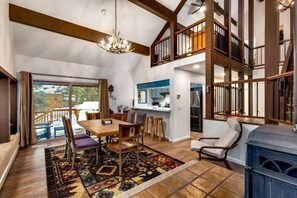 Dining Area with Auto Gas Fireplace, Dimmable light fixture, Sitting area with outlets and USB outlets, going out to the deck for BBQ and entertaining. 