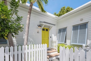 Enter through the sunny yellow door.