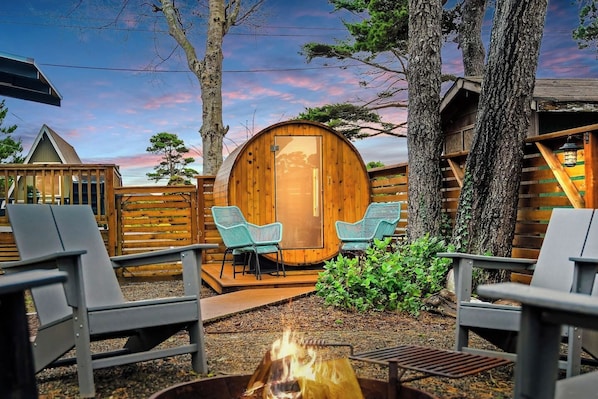 Unwind in our cedar wood barrel sauna! Let the revitalizing warmth embrace you while a crackling fire awaits. The synergy of heat and nature are a haven for relaxation, fostering unforgettable moments in the heart of our charming A-frame retreat. 