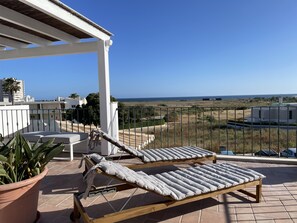 Ocean view roof terrace sun beds