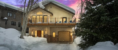 View of 1 car garage & parking