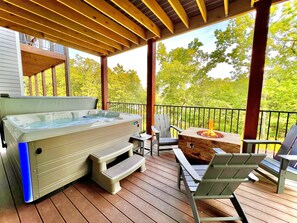 Lower deck complete with private hot tub and fire pit for you to enjoy!