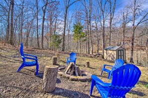 Fire pit with Adirondack Chairs make for a relaxing camp fire