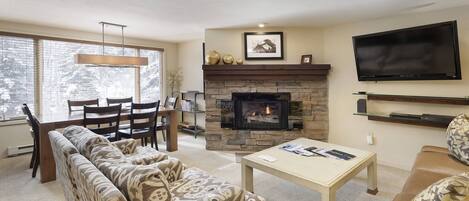 The living area of your vacation rental provides plenty of seating, a gas fireplace and large flat screen TV.