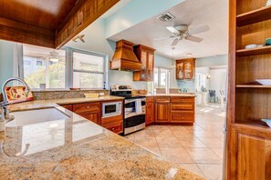 Abundant counter space in the kitchen provides ample room to prepare and serve your meals with ease, ensuring a seamless culinary experience.