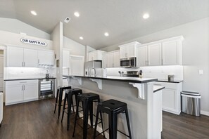 Large kitchen island with bar seating for 4 people