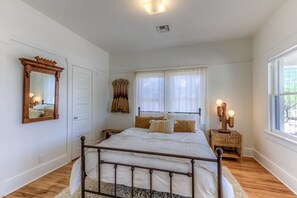 Bedroom 1 with queen bed and blackout shades