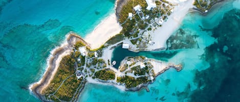 Sea Glass Found is a sprawling, 20-acre property with 360-degree water views on the northern tip of Man-O-War Cay in the Abacos, Bahamas. With multiple living cottages, there is plenty of space for large groups to spread out. 