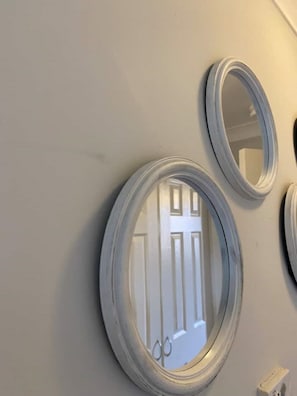 The hot water thermostat found under the circle mirrors.