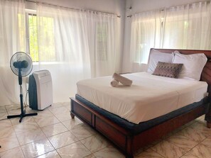 the second bedroom is very bright with the window front
