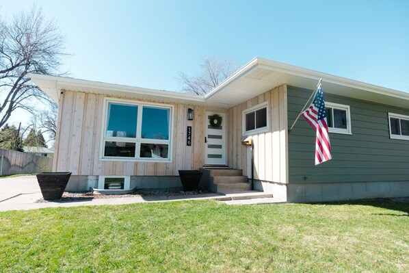 Exterior view of the home. Long driveway for parking.