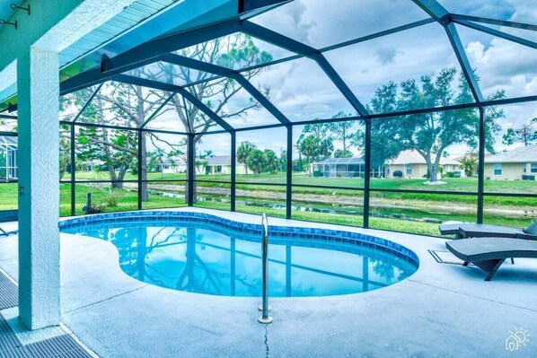 Elegant pool deck offering panoramic views of the waterway