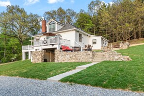 Front of house/front deck and stone wall