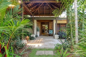 Lush foliage surrounds the villa, making you feel like you've arrived at your very own tropical resort.