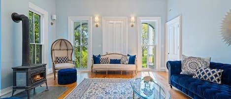 The living room with 20-foot ceilings. This room gets plenty of natural light