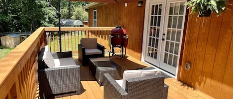 Main patio with seating area and grill. 