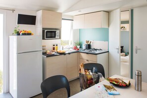 A bright kitchenette in a cozy corner.