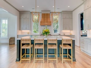 Custom kitchen and island with bar stools
