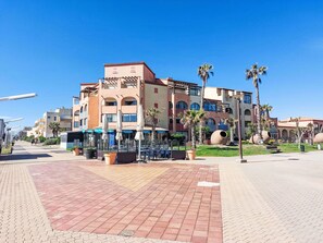 Town, Public Space, Mixed-Use, Apartment, Shade, Hotel, Balcony, Walkway