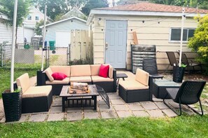 Beautiful outdoor seating area with fire pit for these chilly evenings.