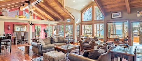 Frosted Shore features a stunning interior with vaulted ceilings and huge windows.