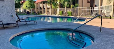 Luxurious shared pool and spa with large covered pool deck for your use.