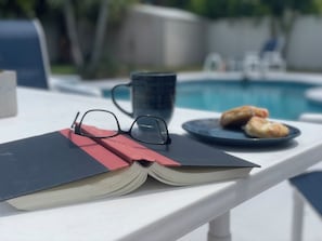 Enjoy a great read while sipping on a coffee overlooking the pool. Does it get any better than this? 