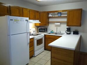 Stocked kitchen with full size appliances. 