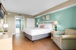 Relax in this bright and spacious bedroom featuring a plush king-sized bed, stylish coastal decor, and ample natural light. Perfect for unwinding after a day of beach adventures!