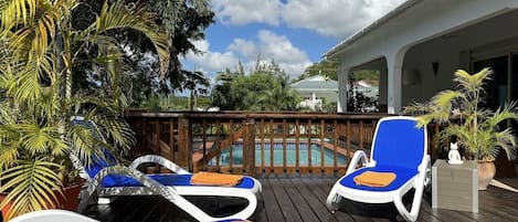 Sun loungers and gated pool