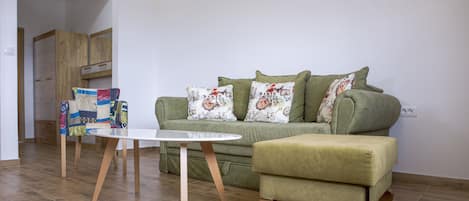 Comfy sofa with armchair. We did our best to make a nice, warm place for you!